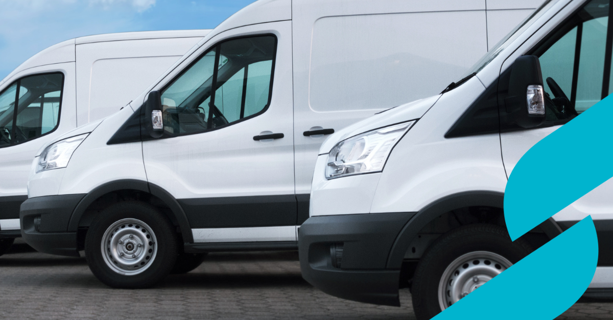 3 white transit vans parked in a line