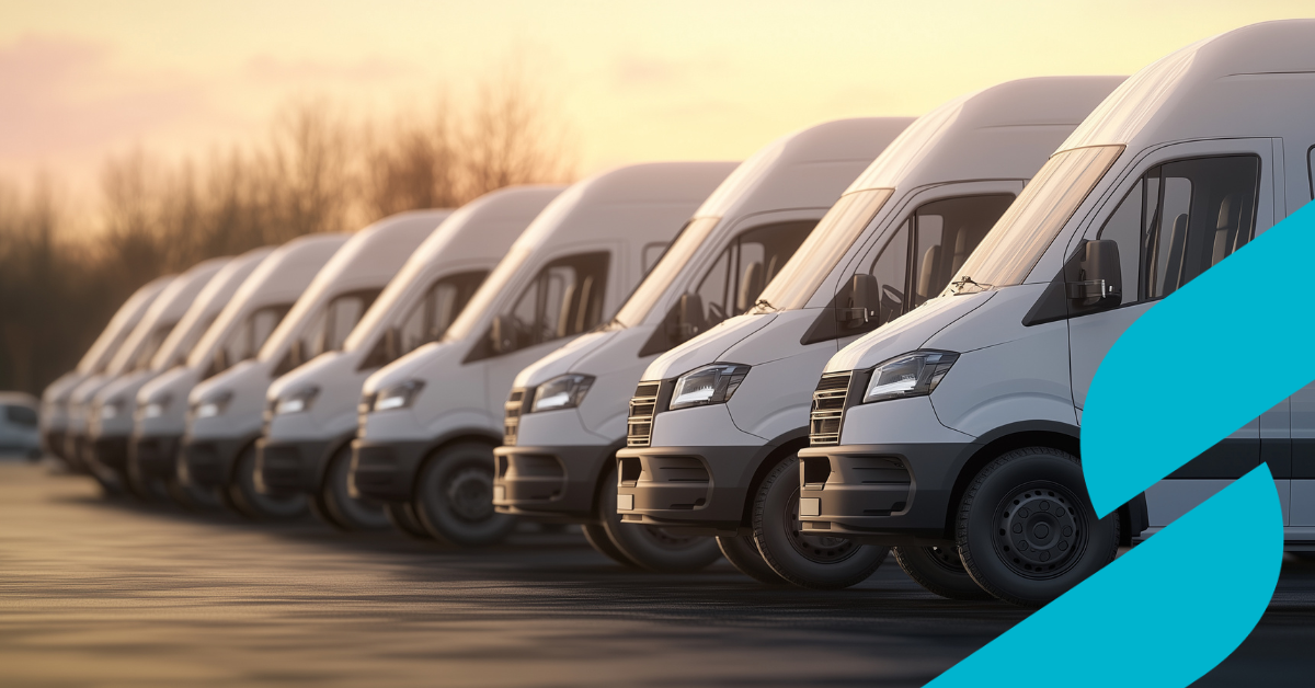 a fleet of vans with the sun setting in the background 