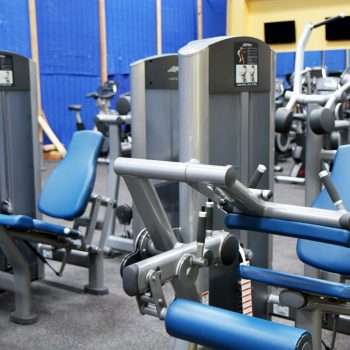 Gym equipment finance machine weights in a gym